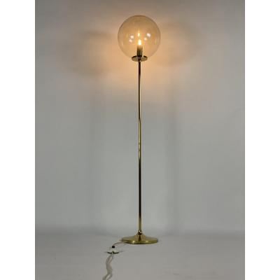 Brass floor lamp with glass globe