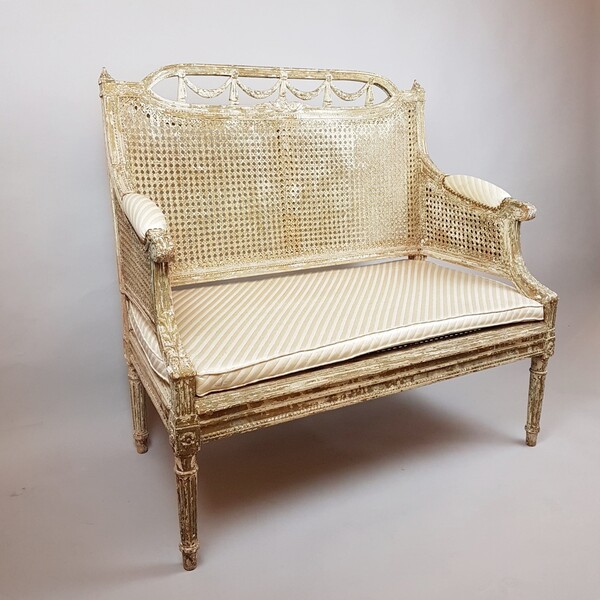 Louis XVI style cane bench in patinated wood, 19th