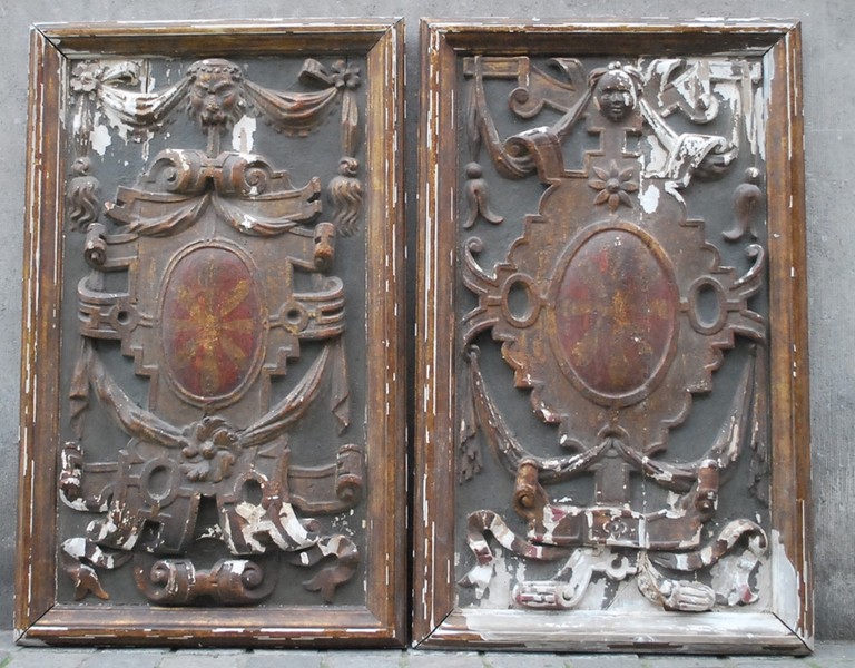 Pair of carved and painted low relief, late 17th C. / early 18th C.