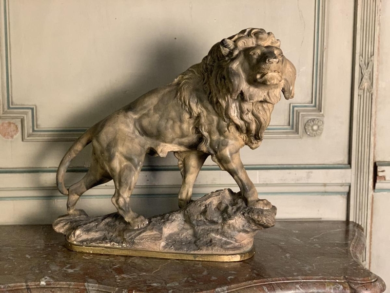 Terracotta lion sculpture, signed Amorgasti