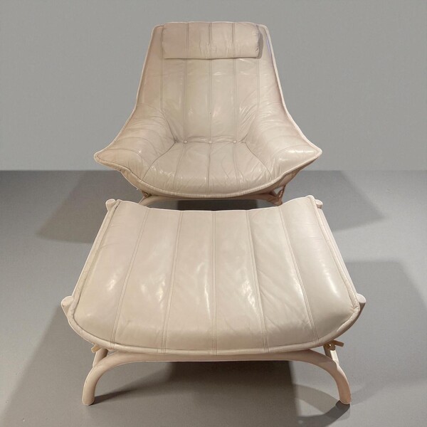 Armchair and footstool in white leather and white patinated rattan, circa 1970