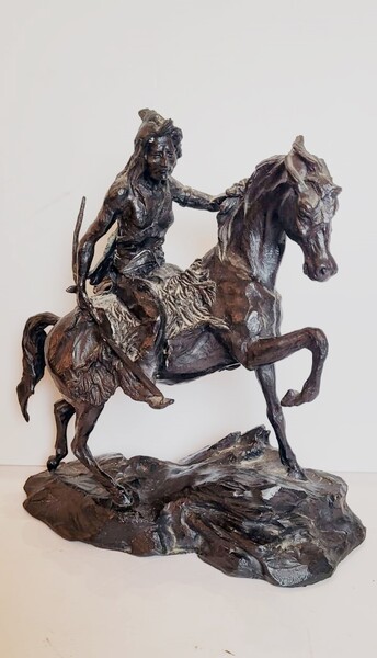 Bronze sculpture with dark patina representing an Indian on his horse