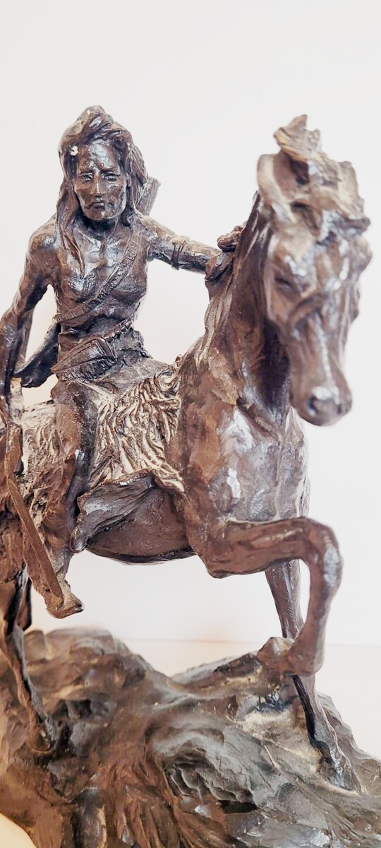 Bronze sculpture with dark patina representing an Indian on his horse