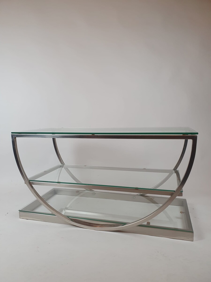 Brushed steel coffee table with glass shelves, circa 1970