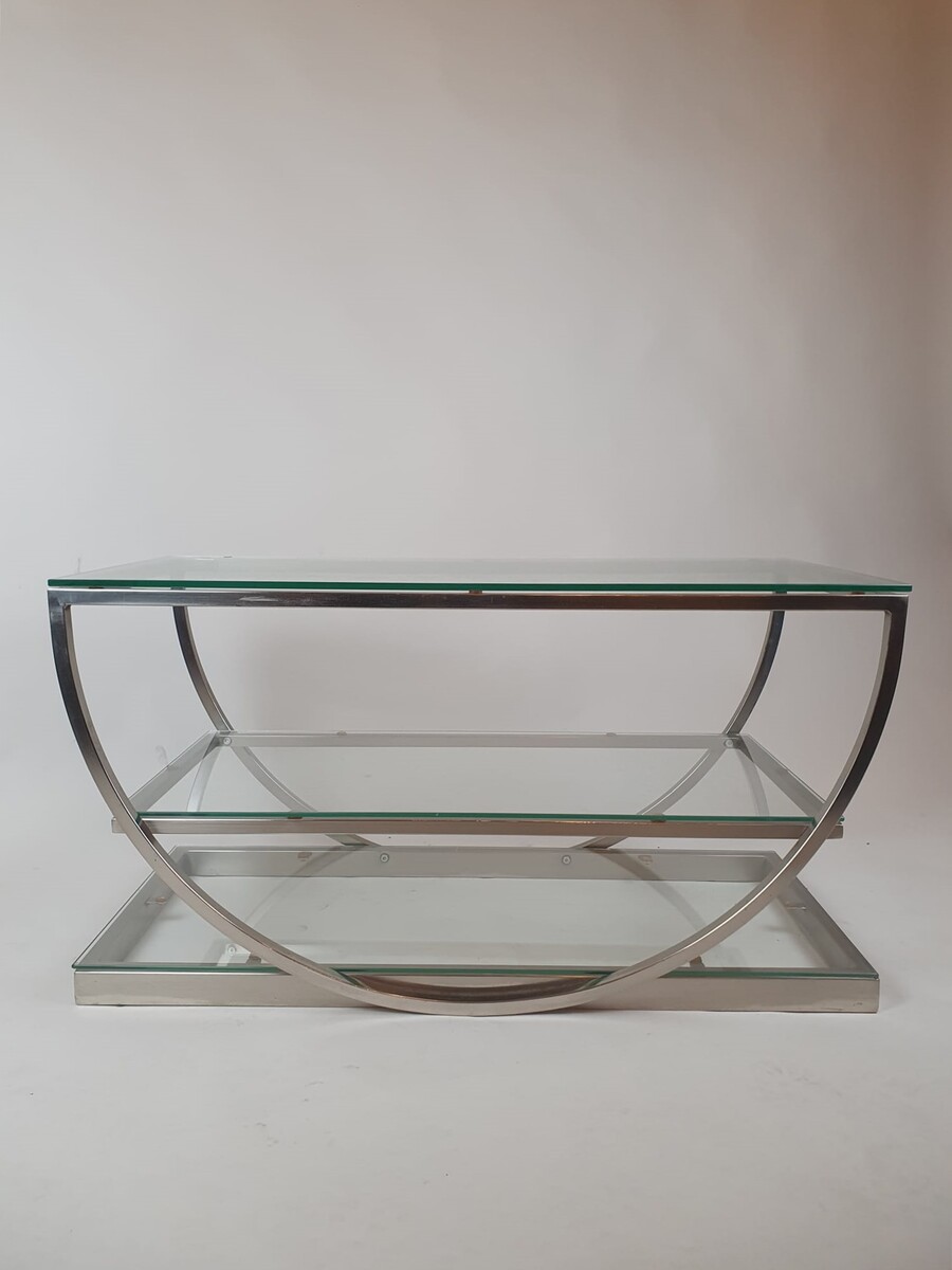 Brushed steel coffee table with glass shelves, circa 1970