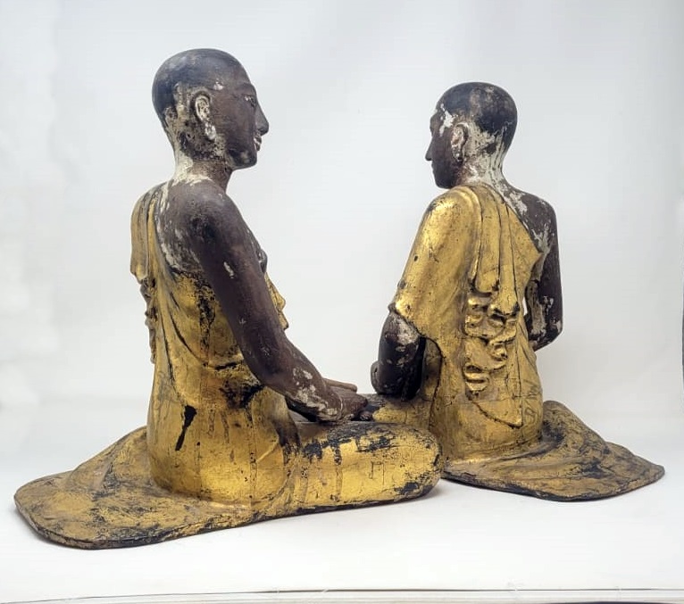 Buddhist monks in polychrome carved wood