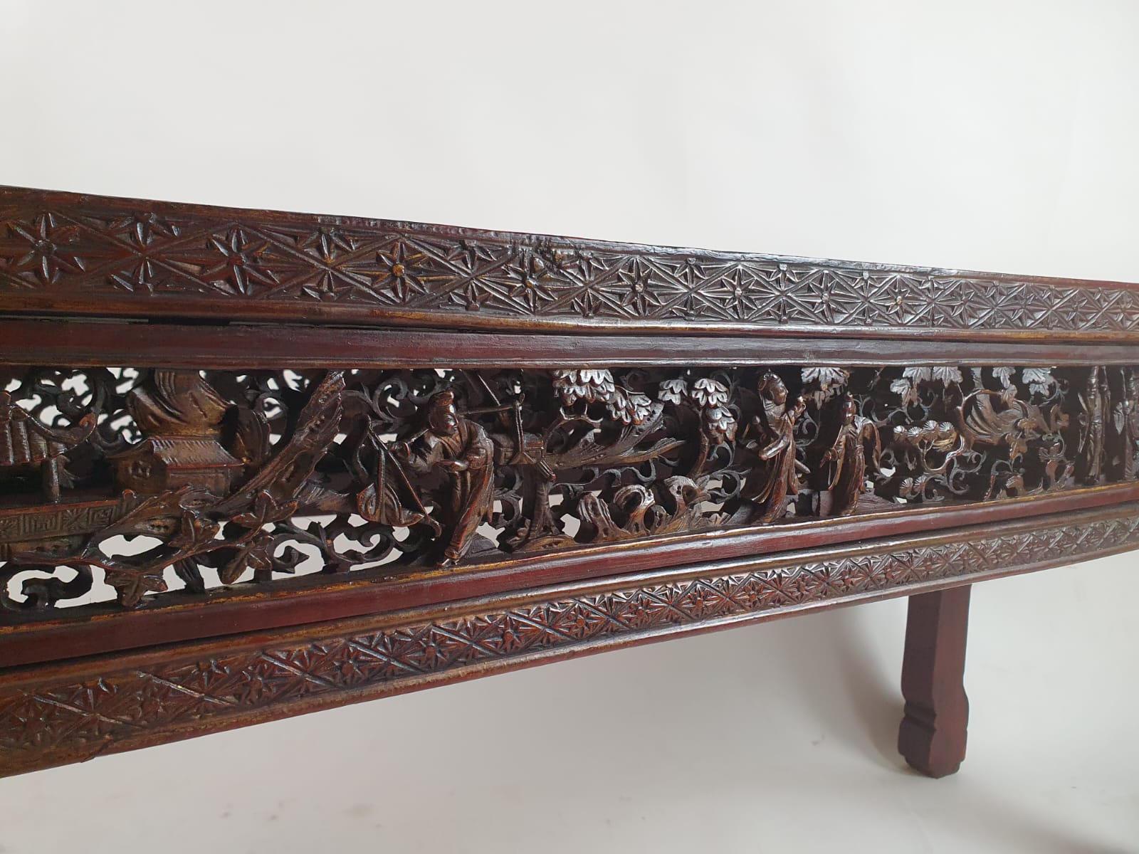 Chinese bench, red lacquered, finely carved with figures, early 20th century