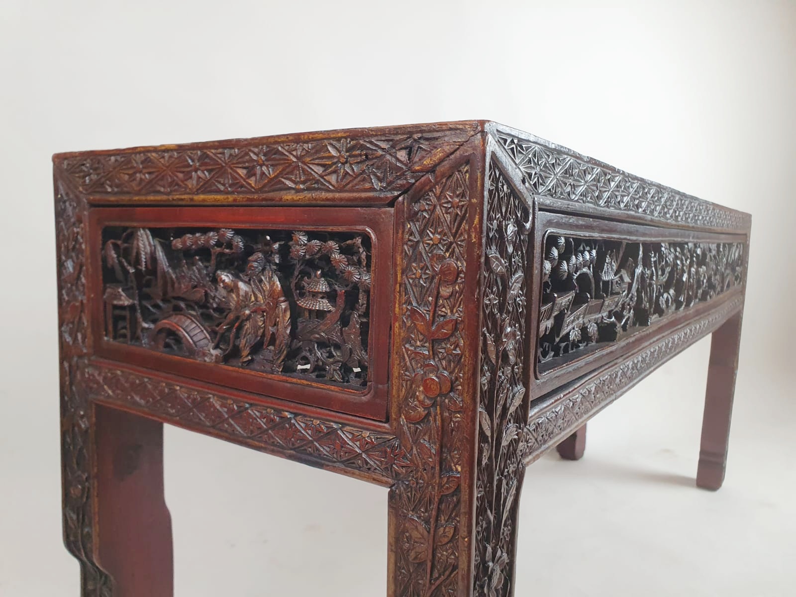 Chinese bench, red lacquered, finely carved with figures, early 20th century