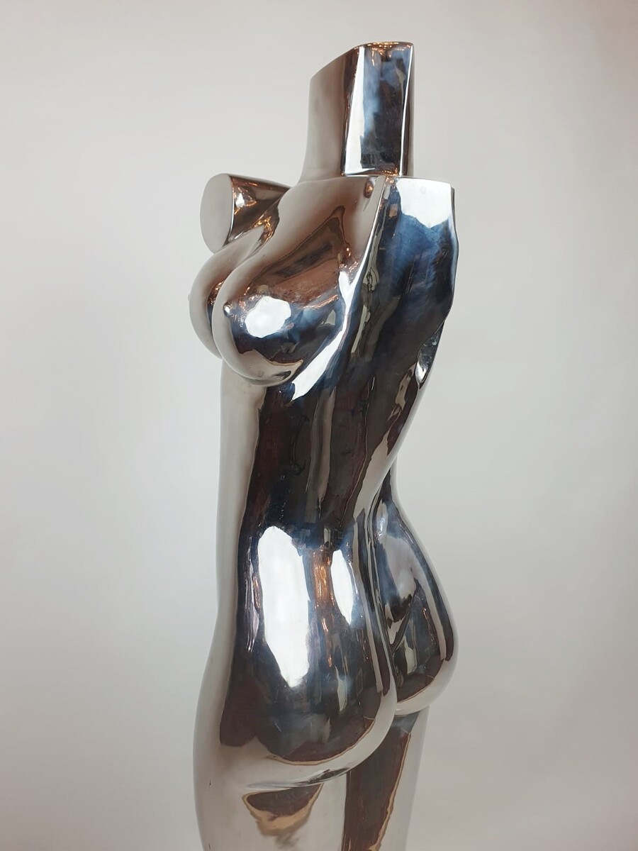 Chromed metal sculpture - signed on base Romana 2/2