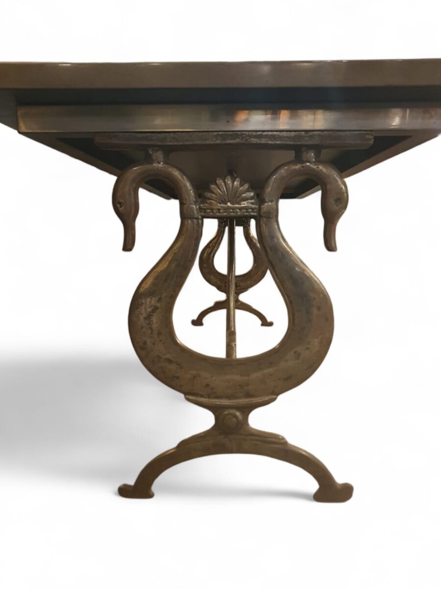 Dining room table in the style of Maison Jansen, lacquered top, cast iron and wrought iron base, circa 1970