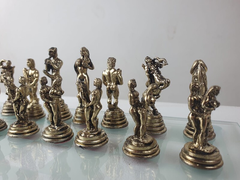 Erotic chessboard in silver metal and glass top