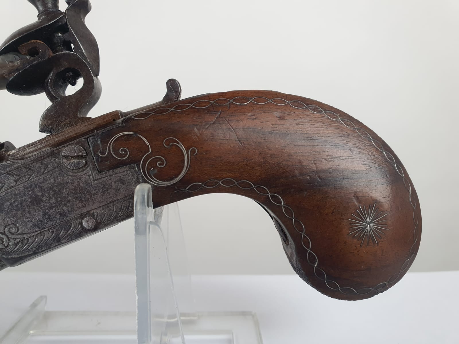 Flintlock pistol with silver wire on the stock, retractable trigger, France, circa 1800