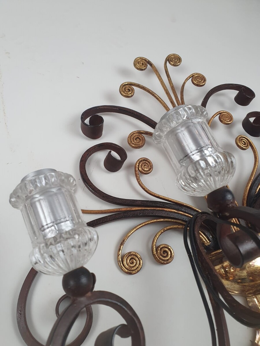In the style of Bagues, pair of wrought iron and glass wall lights