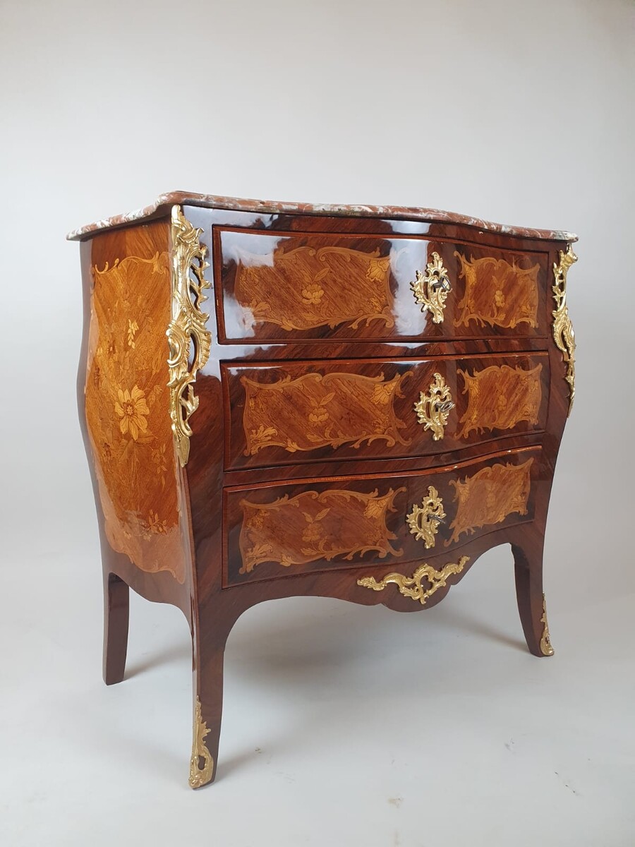 Louis XV style chest of drawers inlaid with rosewood and fruitwood