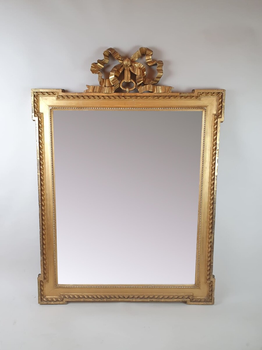 Louis XVI style mirror in gilded wood, late 19th century