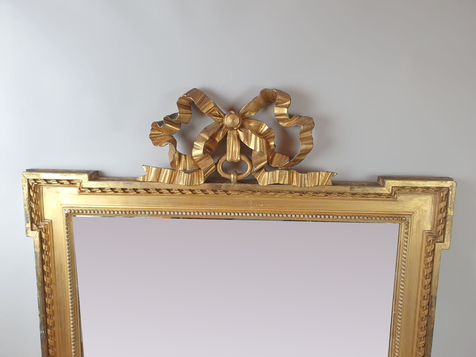 Louis XVI style mirror in gilded wood, late 19th century