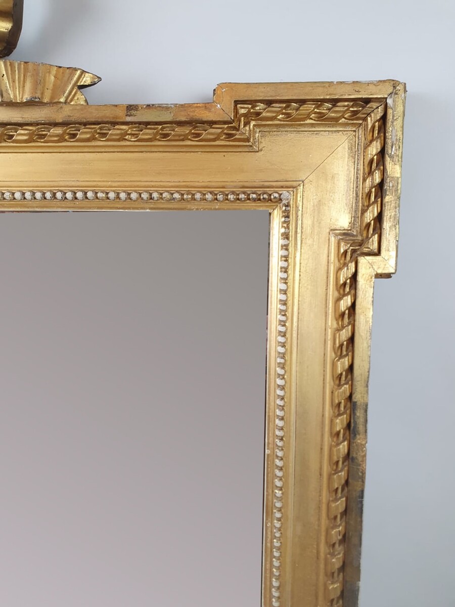 Louis XVI style mirror in gilded wood, late 19th century