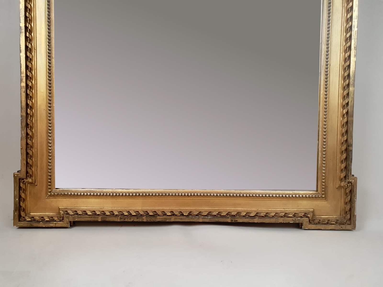 Louis XVI style mirror in gilded wood, late 19th century