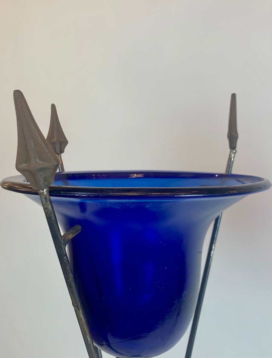 pair of blue glass basins on wrought iron arrow bases