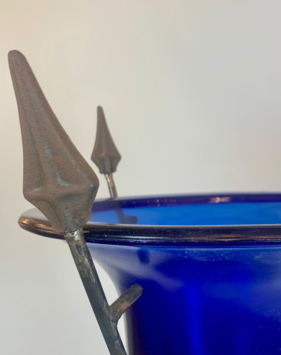 pair of blue glass basins on wrought iron arrow bases