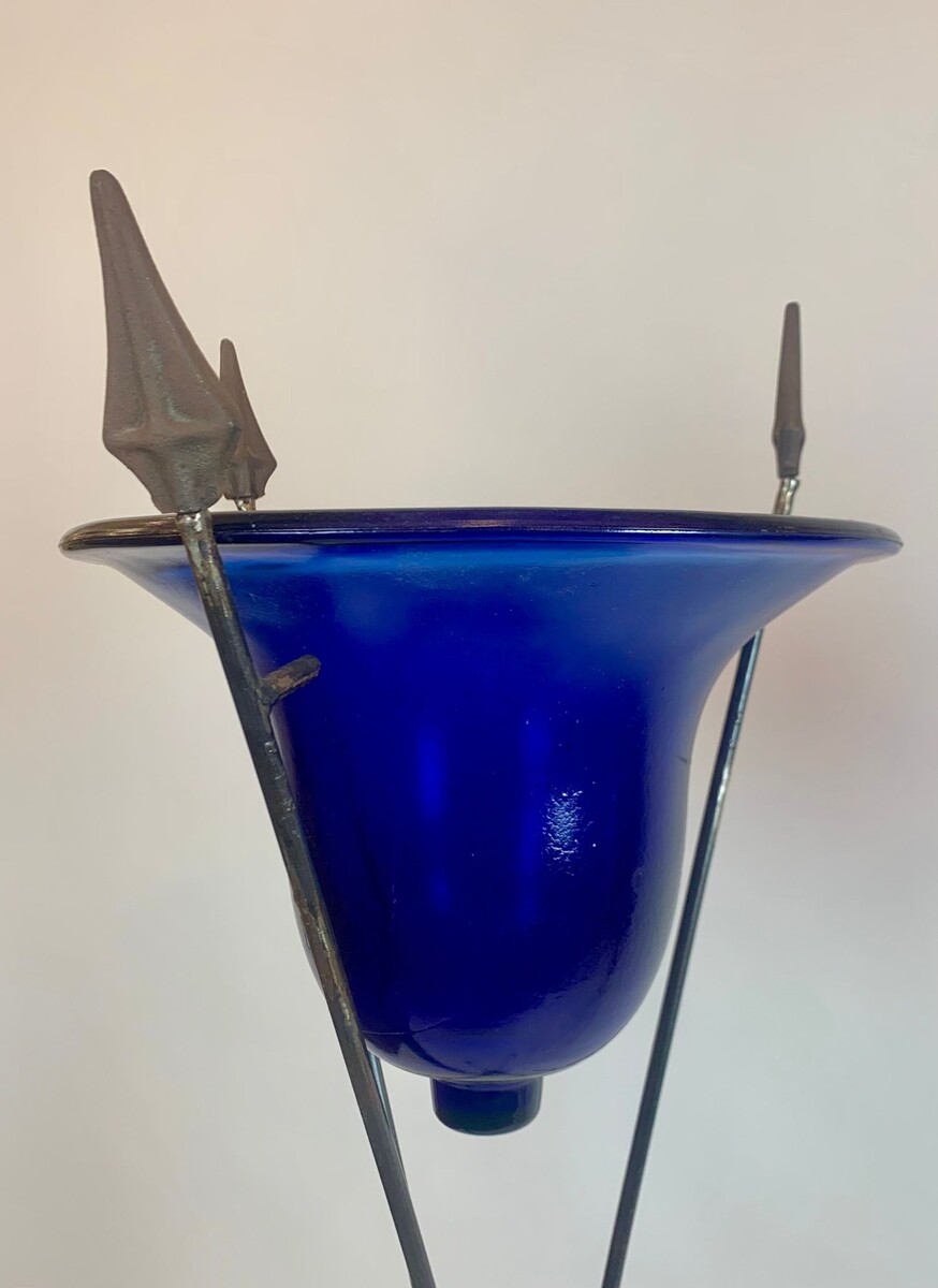 pair of blue glass basins on wrought iron arrow bases