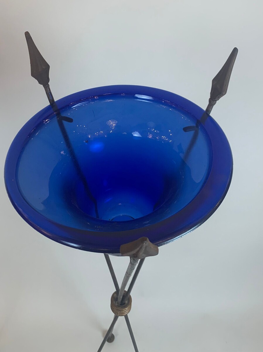 pair of blue glass basins on wrought iron arrow bases