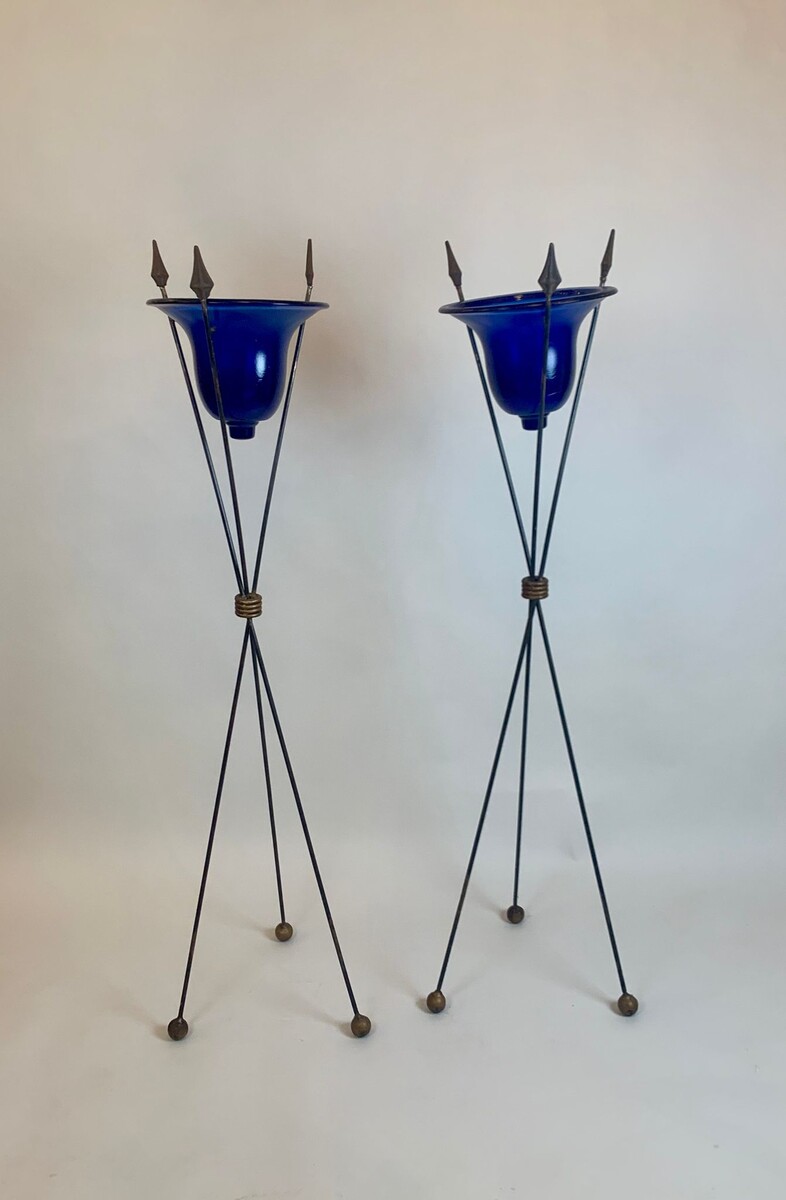 pair of blue glass basins on wrought iron arrow bases