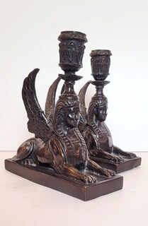 pair of bronze candlesticks with dark patina representing sphinxes - circa 1900