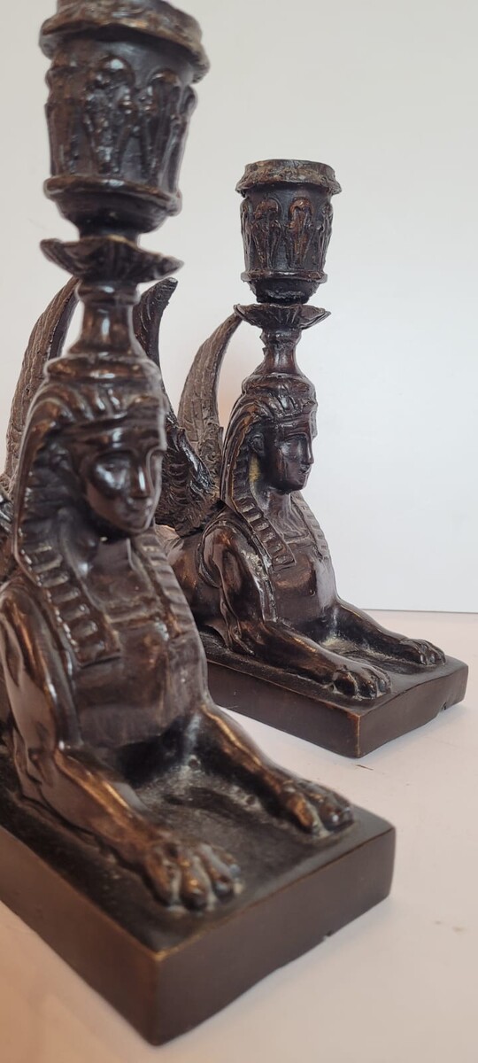 pair of bronze candlesticks with dark patina representing sphinxes - circa 1900