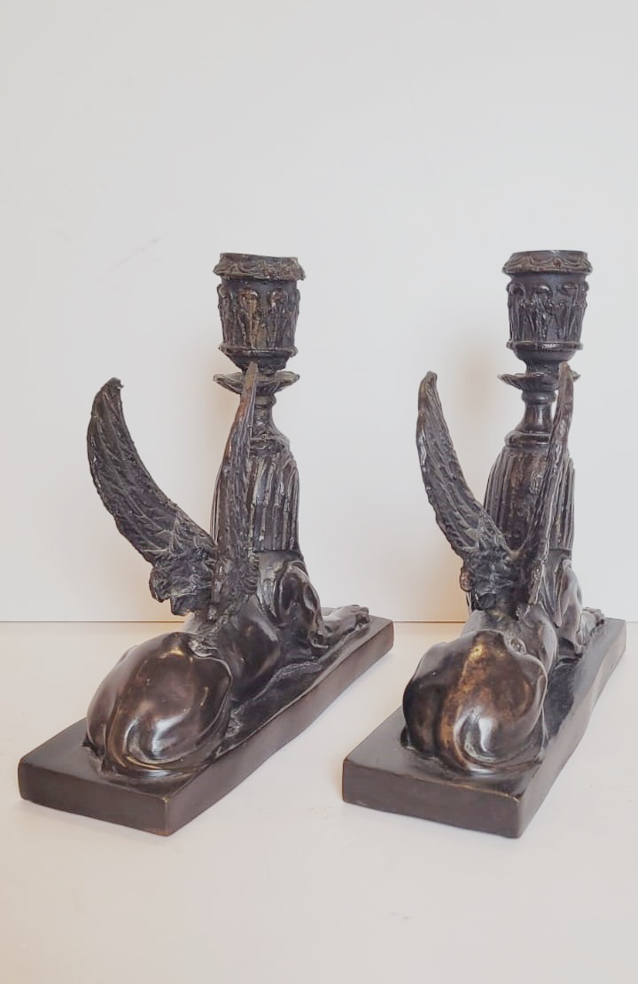 pair of bronze candlesticks with dark patina representing sphinxes - circa 1900