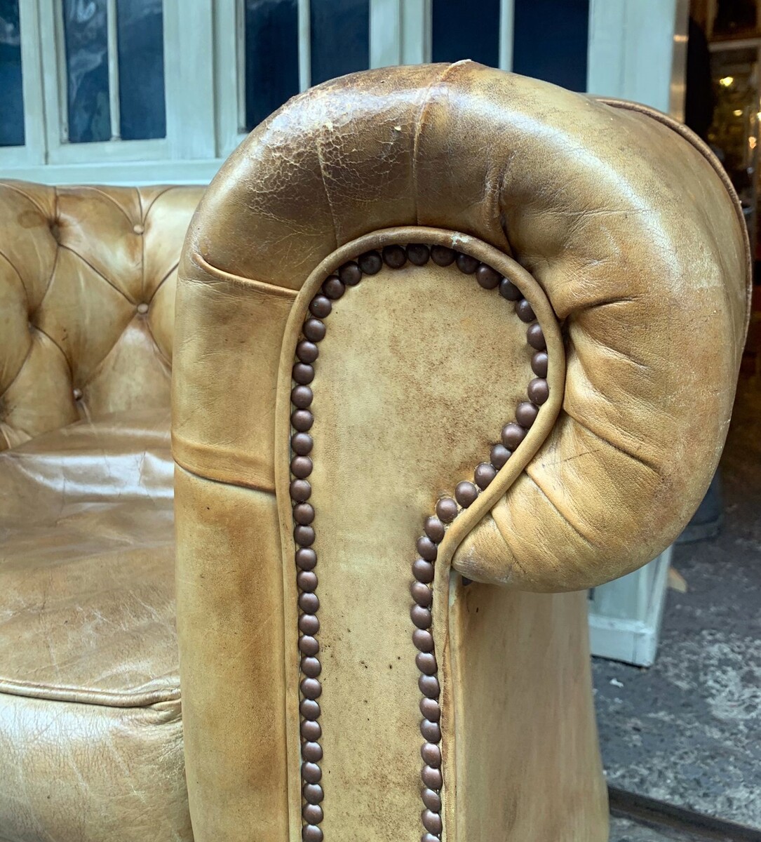 Pair of caramel-colored chesterfield armchairs