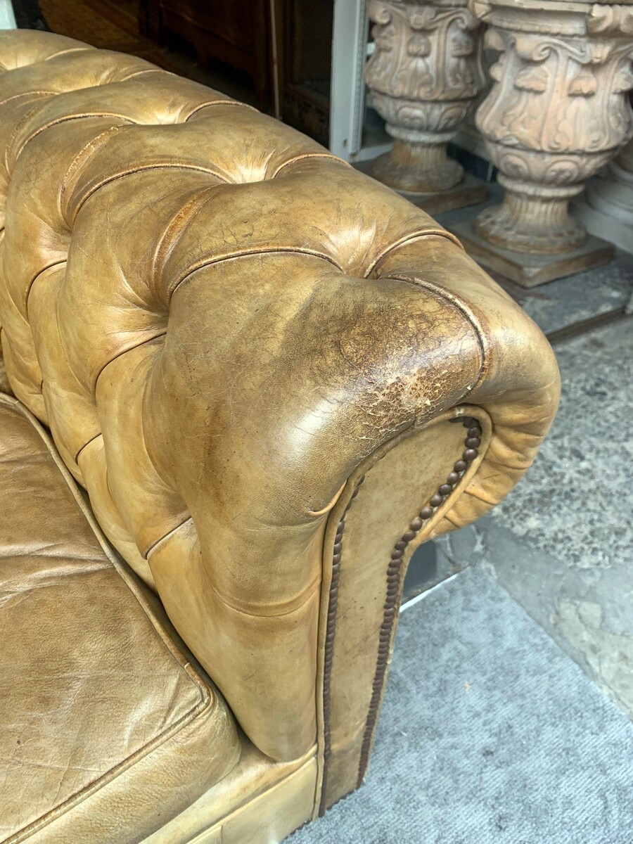 Pair of caramel-colored chesterfield armchairs