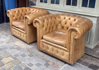 Pair of caramel-colored chesterfield armchairs