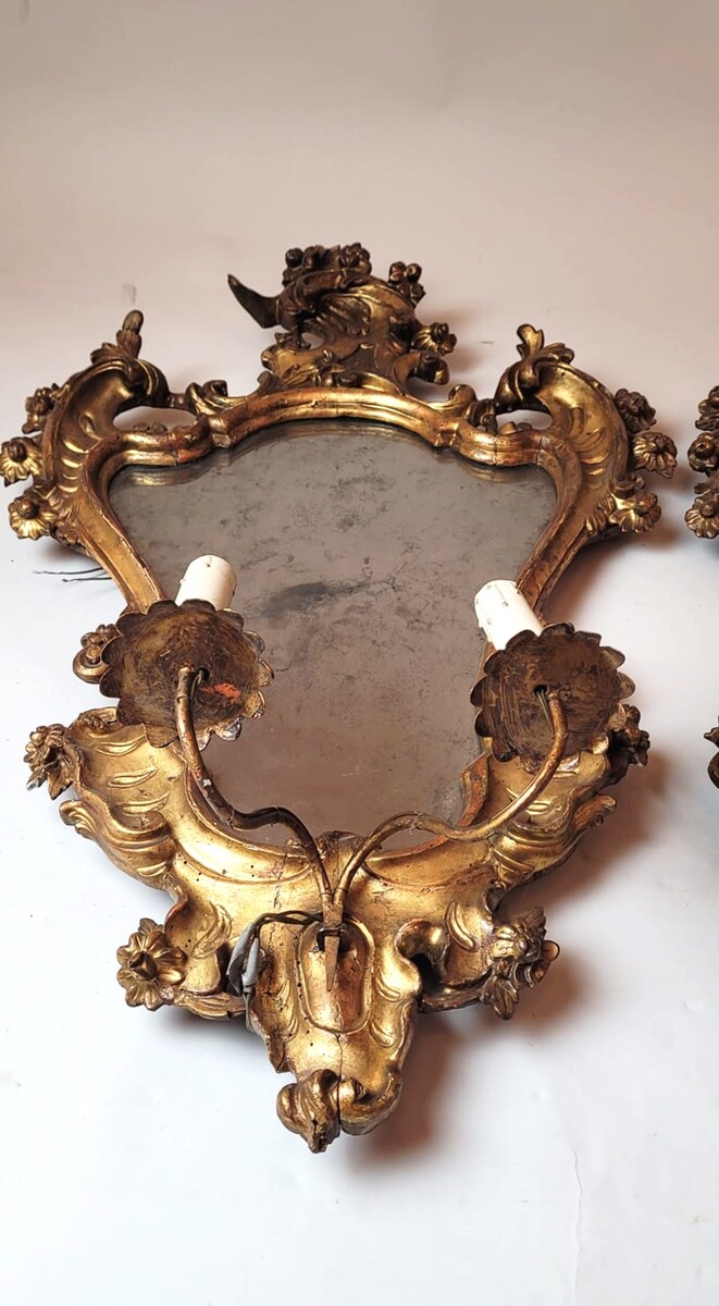 Pair of carved and gilded wooden mirror wall lights, electricity to be reviewed - 1 split mirror