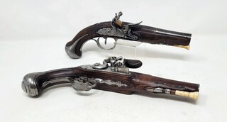 pair of civil flintlock pistols - iron mount with fine chiseling - signed and localized lock - barrel with large traces of gold decoration - carved wood at the thumb piece level - France +/- 1730 - perfect mechanical condition