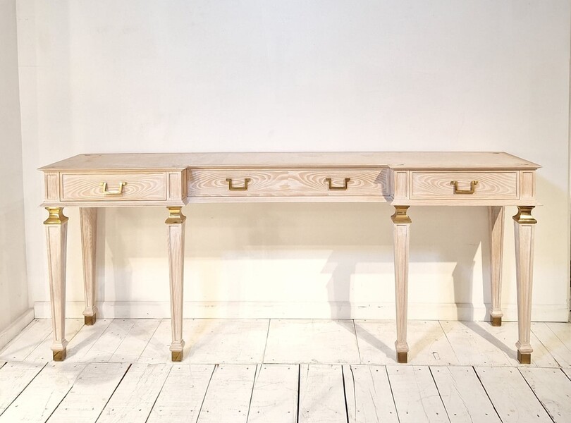 Pair of consoles in limed oak, marble shelf and gilded bronze shoes, 1940s