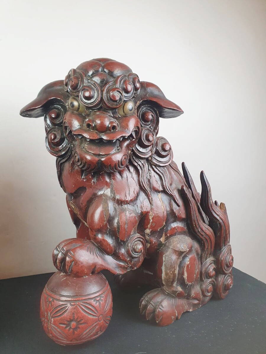 Pair of finely carved red lacquered wood Fô dogs