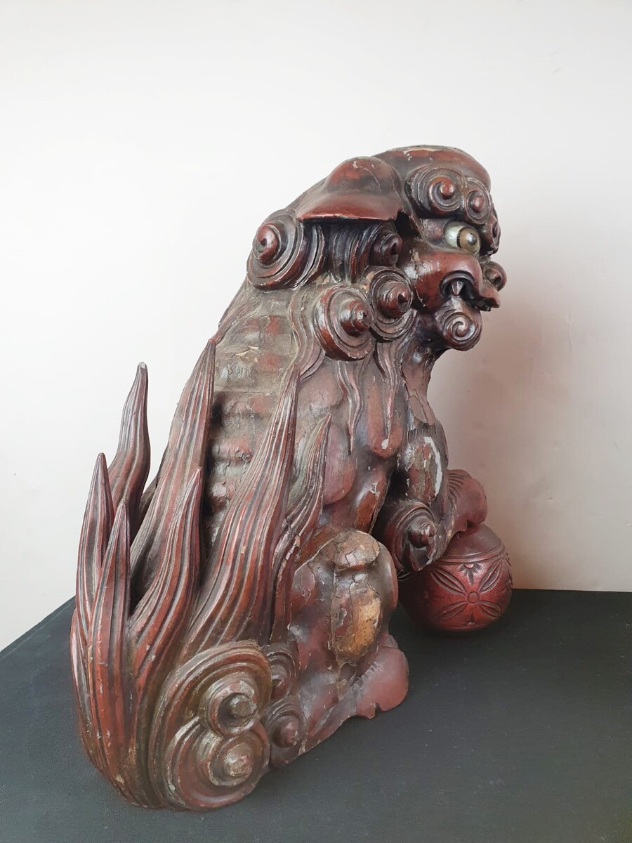 Pair of finely carved red lacquered wood Fô dogs