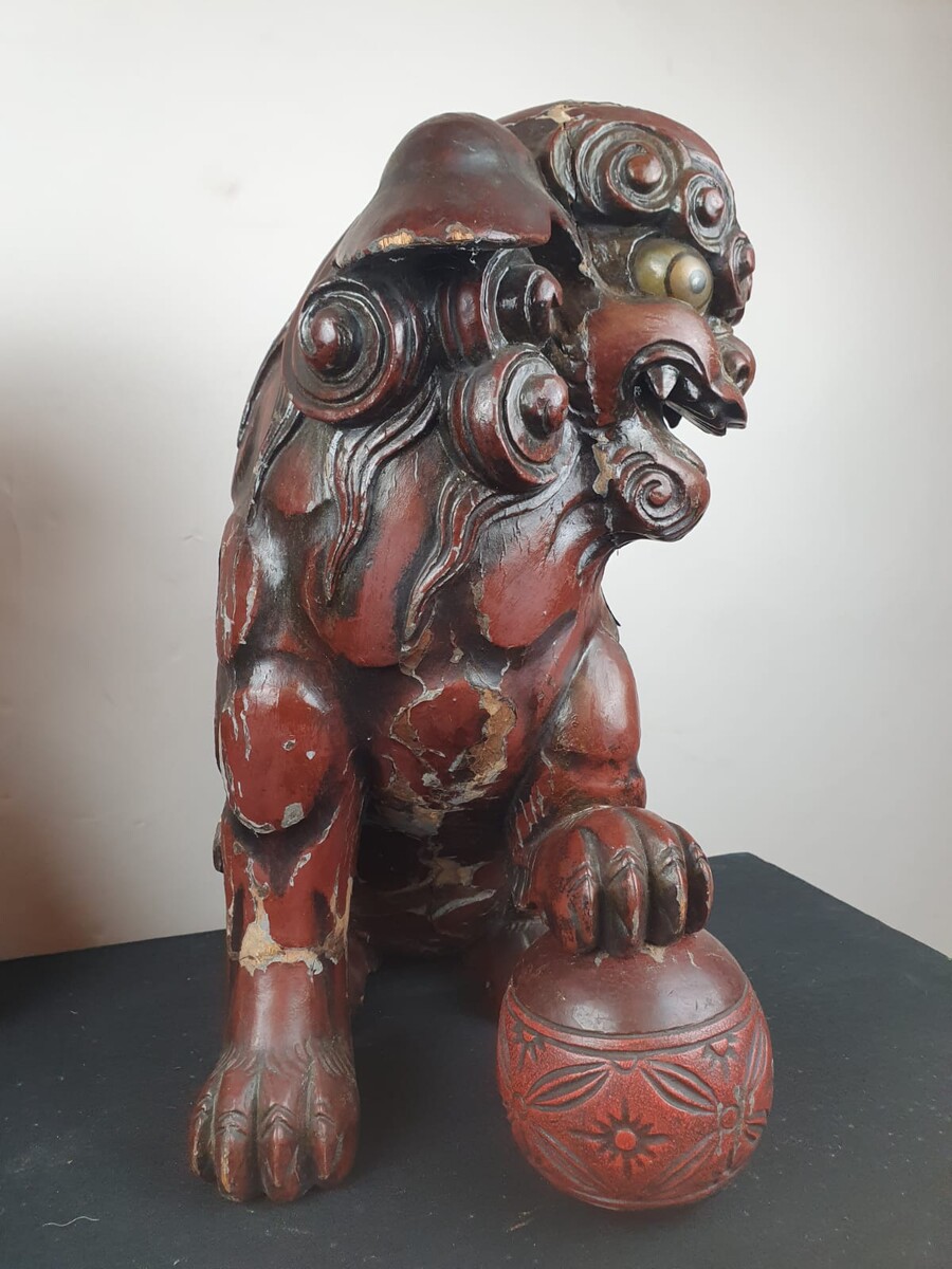 Pair of finely carved red lacquered wood Fô dogs