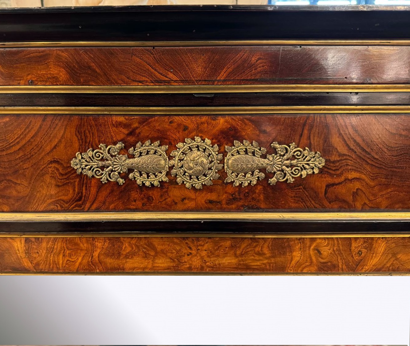 Pair of flamed mahogany and gilded bronze mirrors