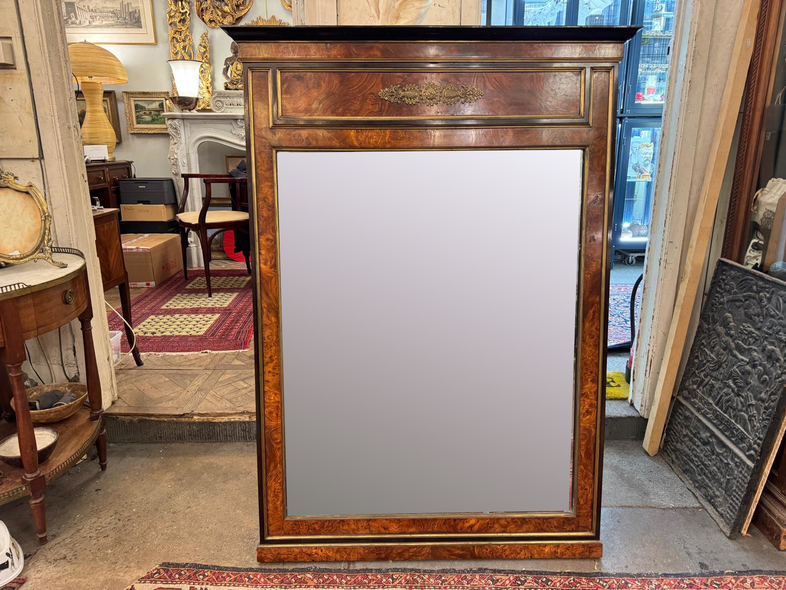 Pair of flamed mahogany and gilded bronze mirrors