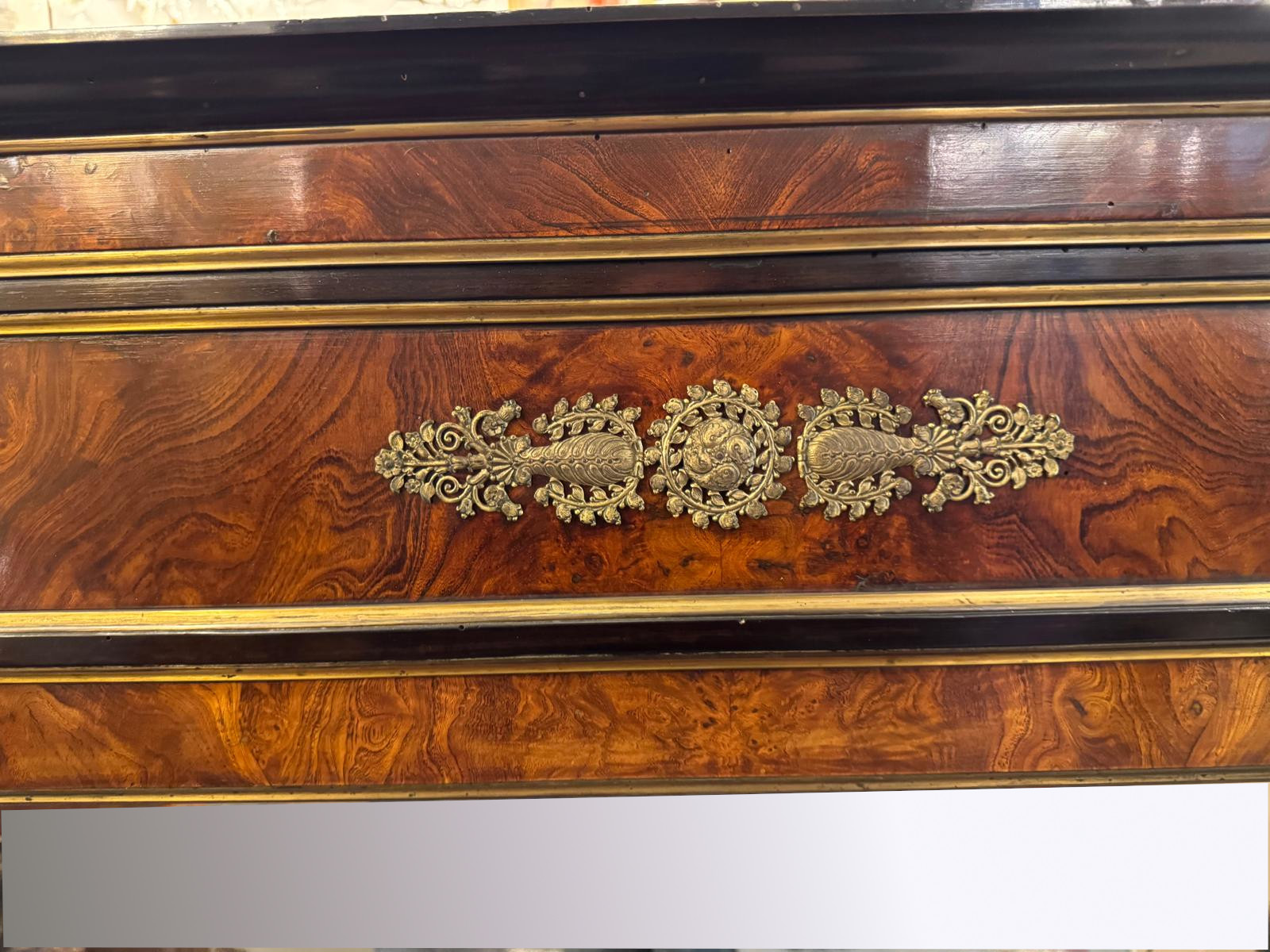 Pair of flamed mahogany and gilded bronze mirrors