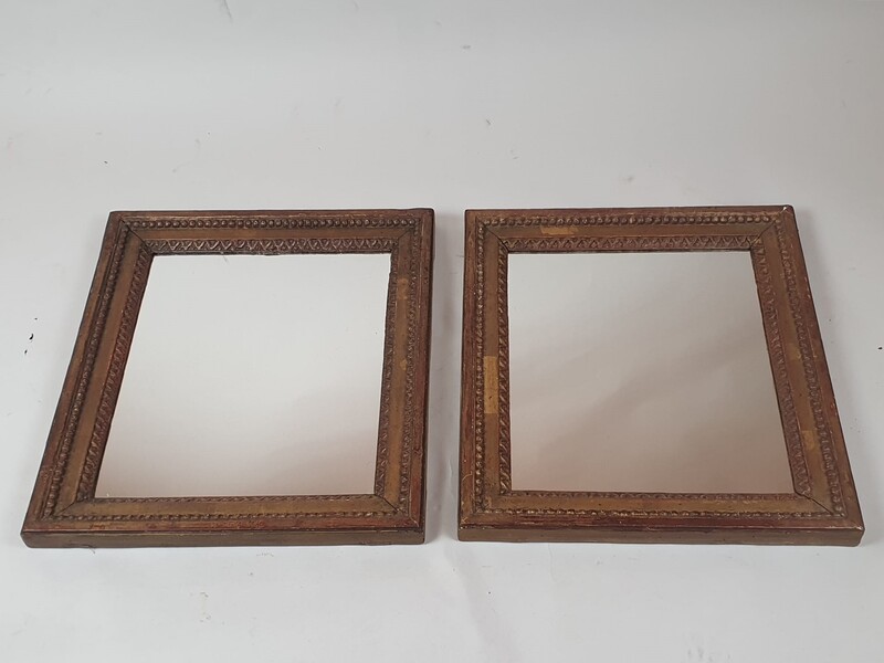 Pair of Louis XVI period mirrors in gilded wood