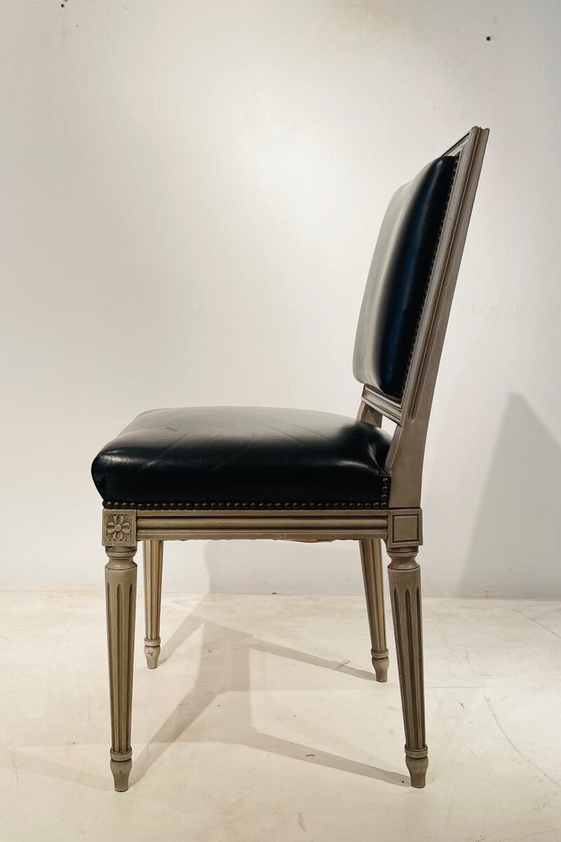 Pair of Louis XVI style chairs in weathered wood and black leather seats