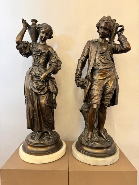 Pair of rustic figures in traditional dress, early 20th century