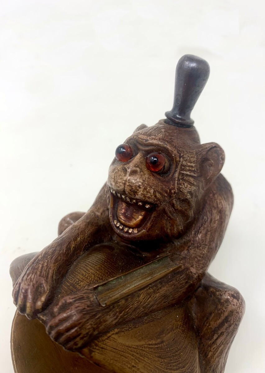 Polychrome bronze monkey lighter - sulphide eyes - complete with scraper and 