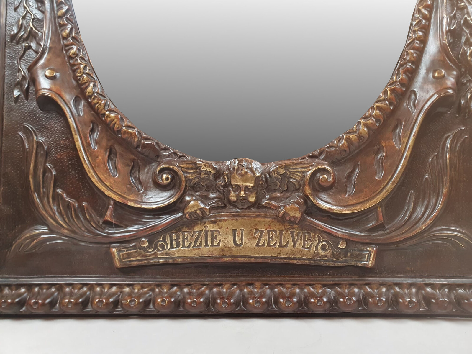 Repousse copper mirror, 19th