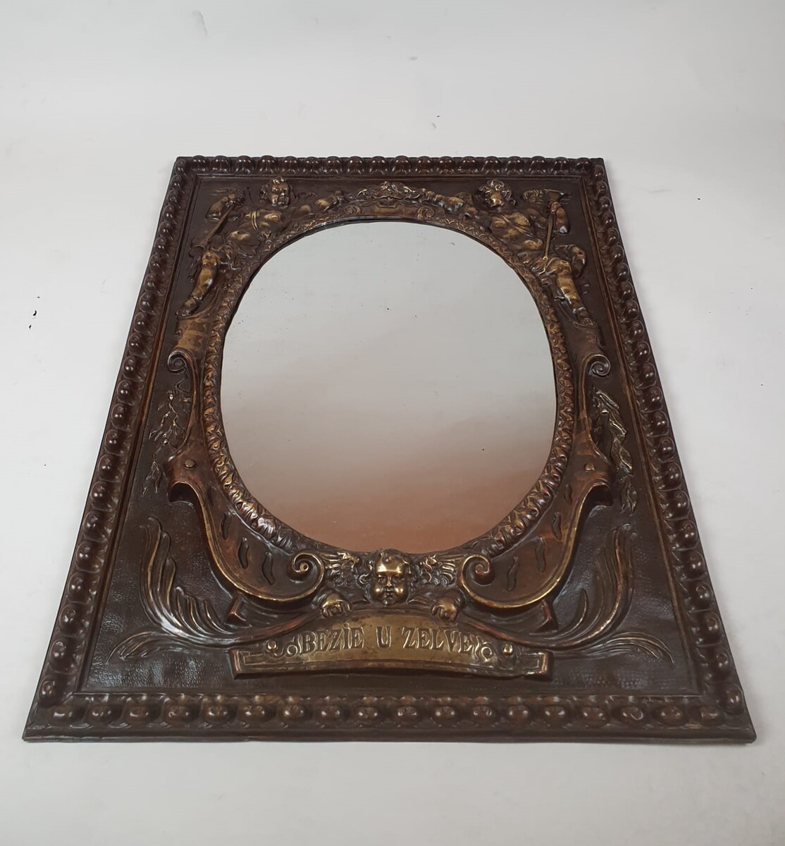 Repousse copper mirror, 19th