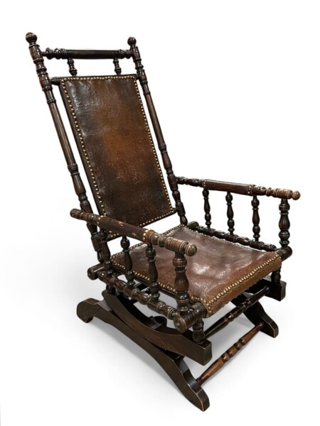 Rocking chair, patinated wood and leather, English work, late 19th century