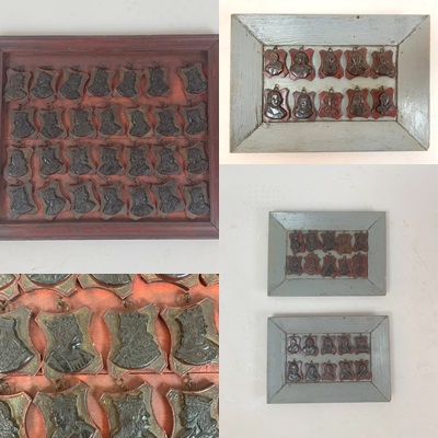 set of 3 frames containing small carved wooden medallions (famous people)